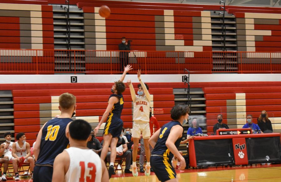 Getting above Glenbrook South, Flavius Ardelean shoots a three-pointer.