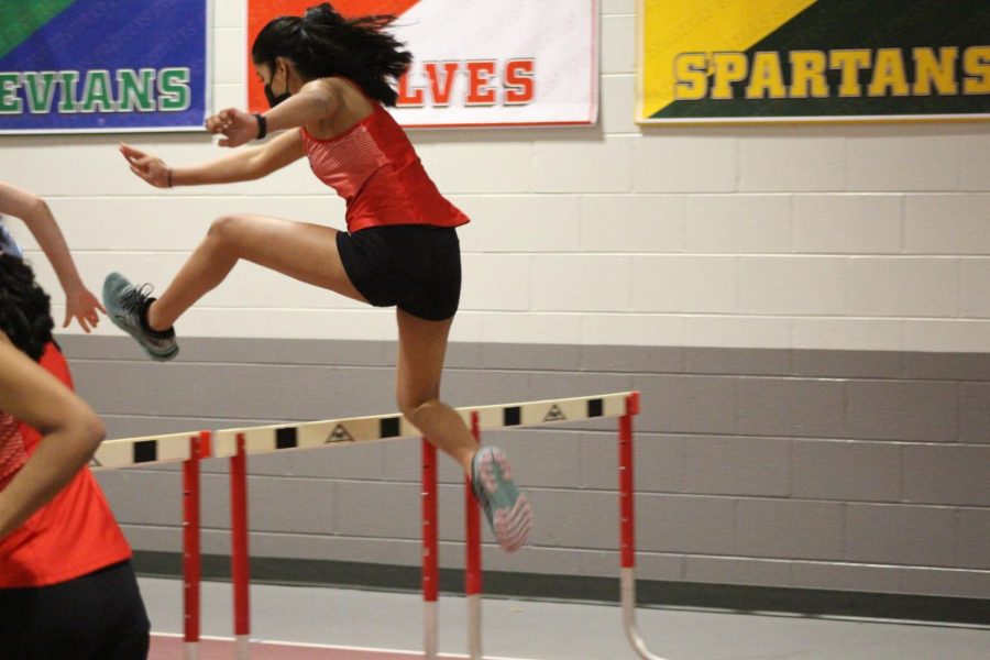 A Niles West hurdler going over the first set of hurdles 