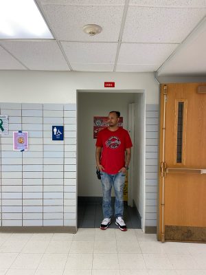 A security guard stands outside of the bathroom where Thursdays assault occurred. As part of administrations efforts to ensure safety at Niles West, more authority figures were present in the hallways and common spaces on Friday, April 29, 2022.