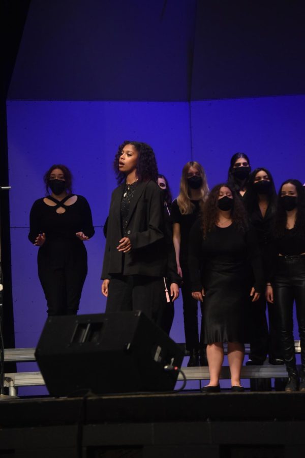 Briyanna Manzanares-Etienne leading Niles West Choir during their last song of the night.