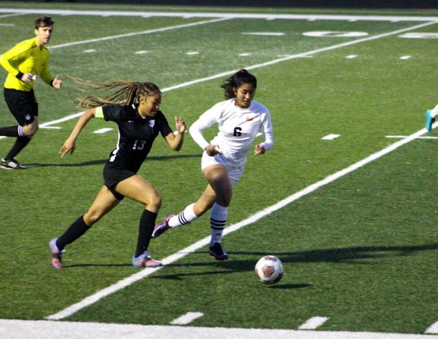 Bianca Cubelo dribbling the ball away from North.