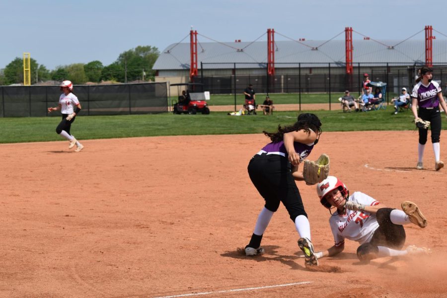 Evie Modena slides to third base just in time.