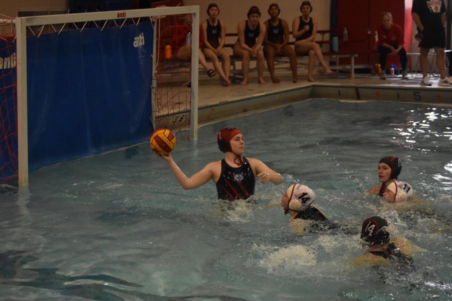 Vaughn Holleran hurls the ball to the other side of the pool.