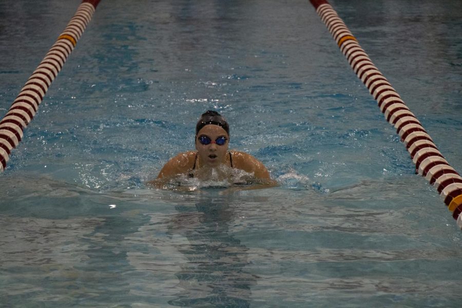 Senior Sara Kadic comes up for breath in a breaststroke event. 