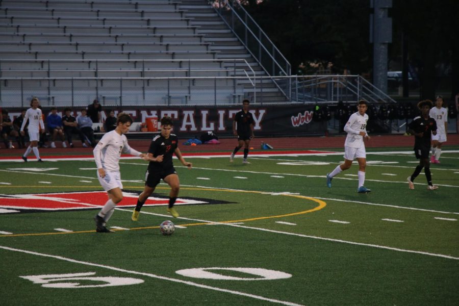 Niles West and Glenbrook South both trying to get the ball.