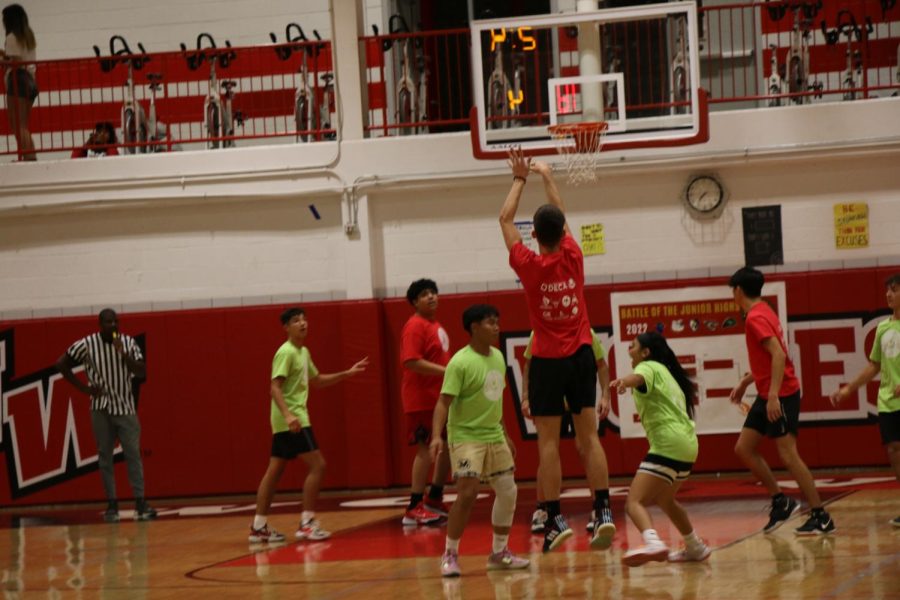 Player from Lincoln Hall attempts a jump shot.