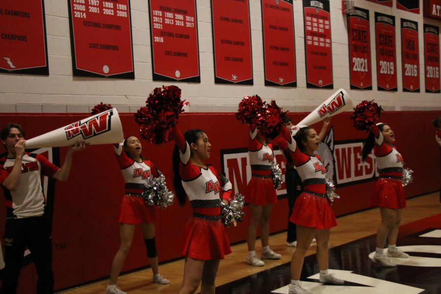 Cheerleaders bring the spirit at the first home game.