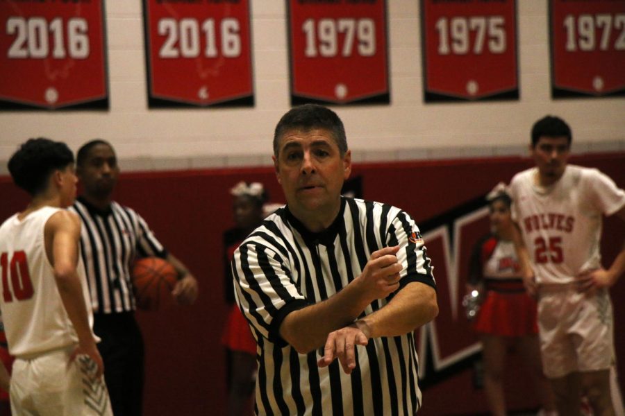 The referee signals to the score table.