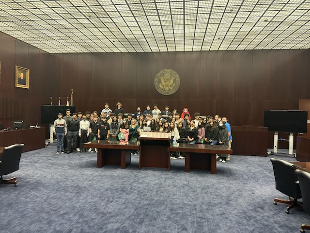 Civics students pose in the courthouse. 