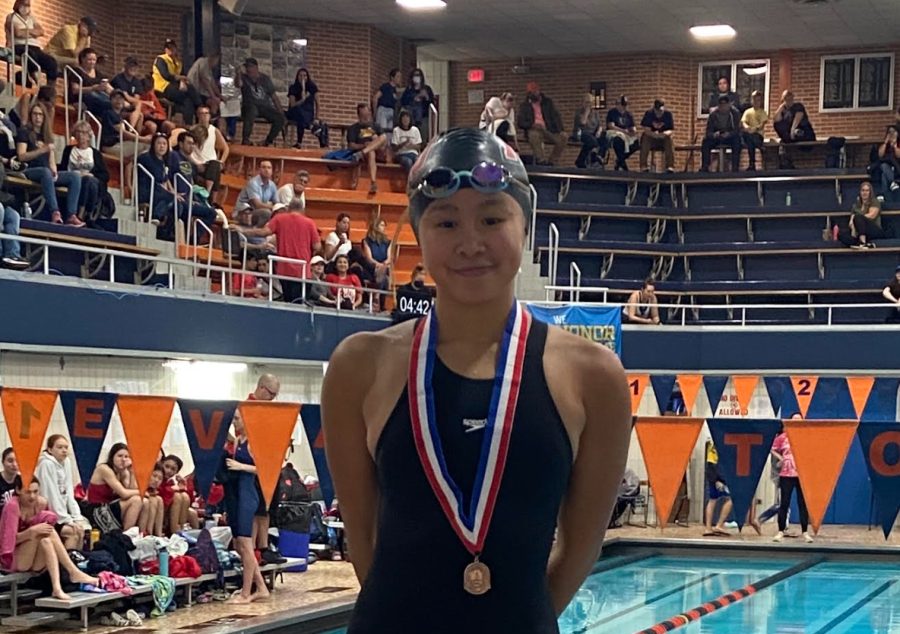 Sydney Dao bringing a metal home from taking 3rd in her race.