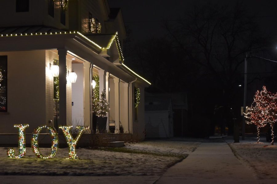 These minimalist christmas lights look right out of a magazine with a festive joy sign.