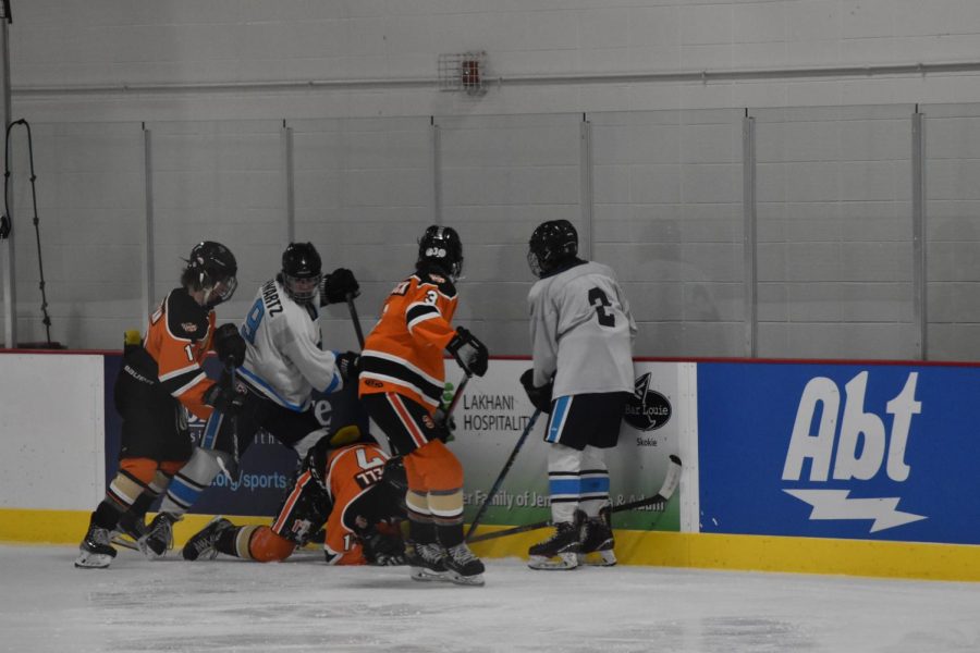 Max Schwartz delivers a body check on Vipers player. 