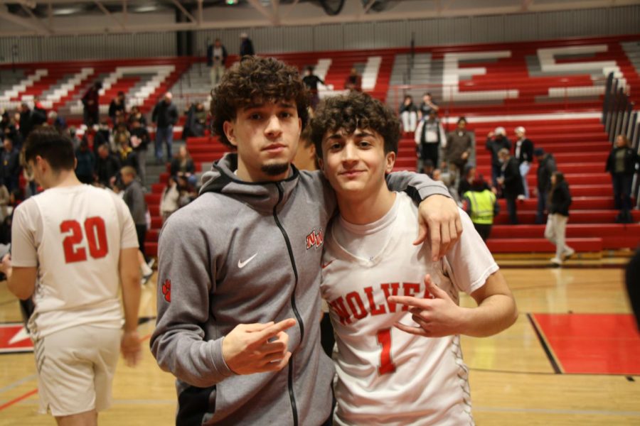 Basketball friends Joey Lazar and Christian Owens keep spirits up after the loss.