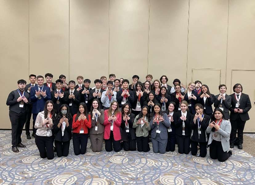 Niles West DECA poses at the Area competition. 