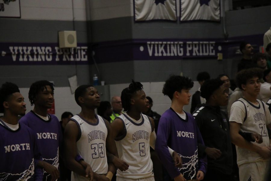 Niles North players rise for the National Anthem