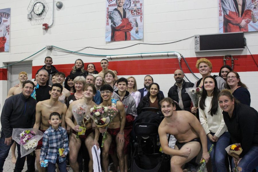 One quick picture of all the seniors and their families before they head back to the meet. 