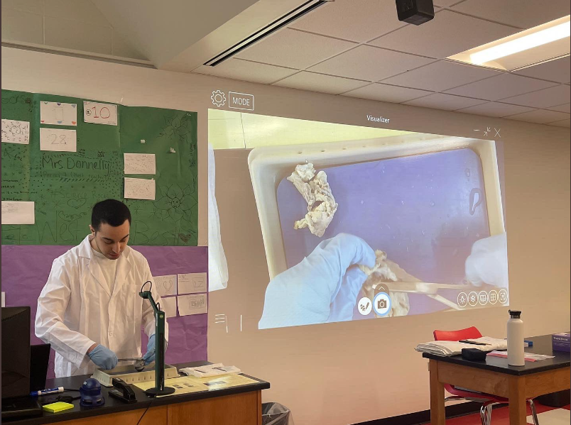 Ali Sayed showing his class how to dissect a cow eye in 2022. 