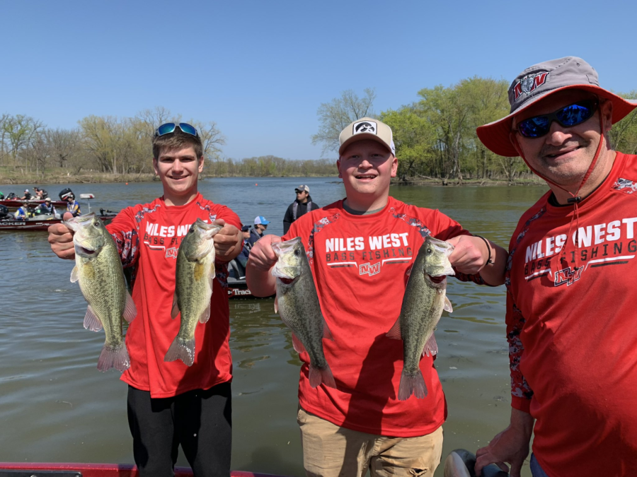 Niles West Bass Fishing team members and coach snapping a quick photo
