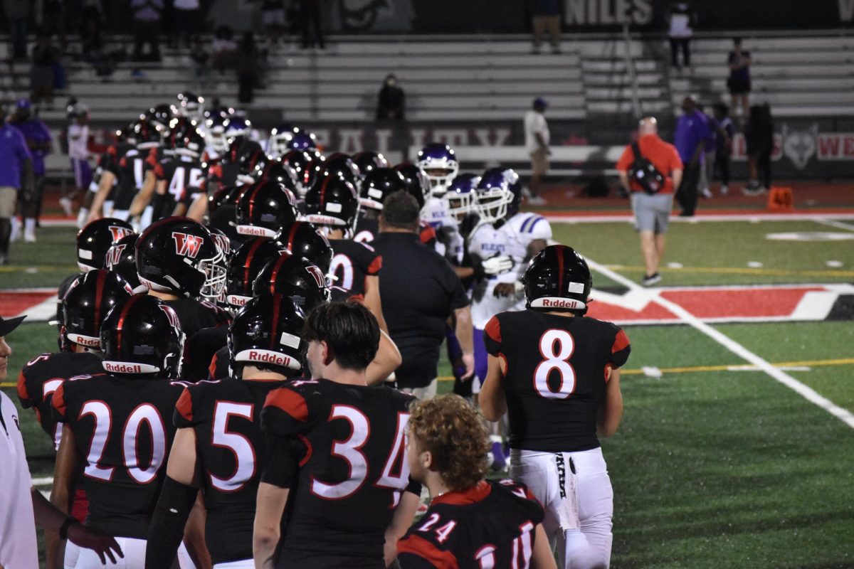 The Wolves line up to shake hands with Thornton at the end of the game. The Wolves won the game 42-13. 