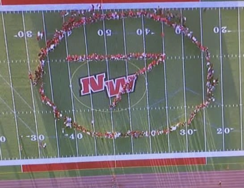 Niles West students and staff form a 7 for the ABC news, found on the Niles Wests Activities Instagram
