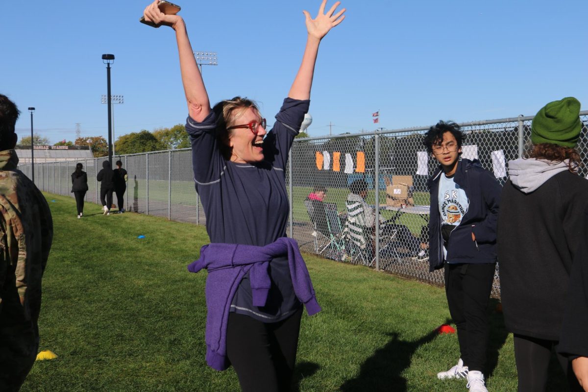 Niles North English paraprofessional Cynthia Fey finishing the 5k.