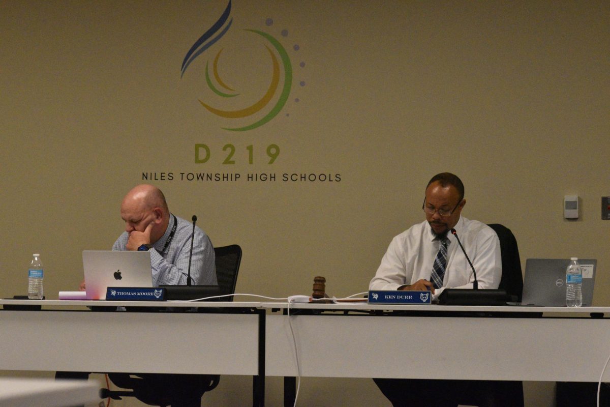 Superintendent+Tom+Moore+and+President+Ken+Durr+listen+to+public+comments+during+the+Nov.+14+board+meeting.+