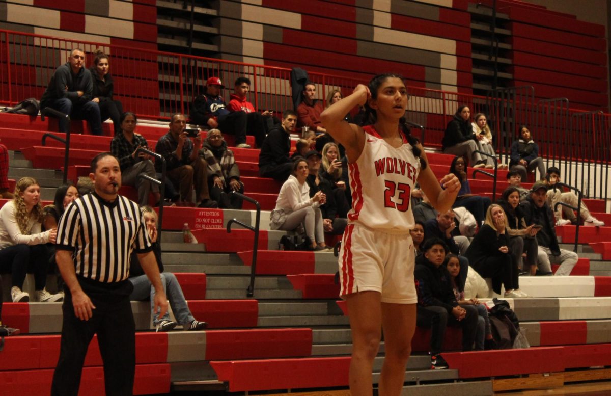 Jeslyn Varghese, senior, follows through her shot and watches to see if the ball entered the basket.