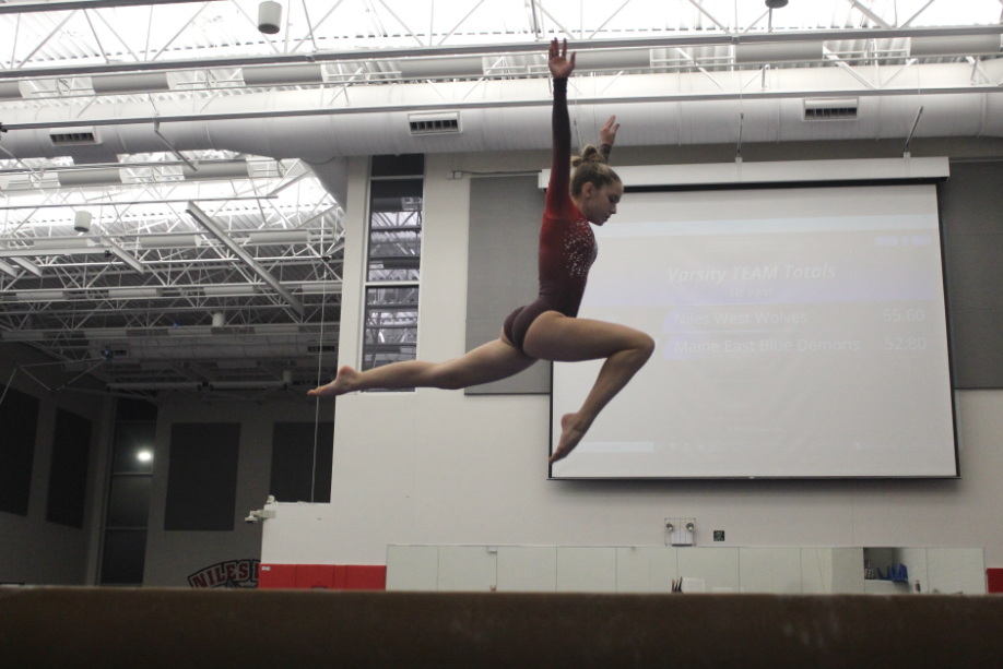 Emelia Oleniczak, freshman, performs a beautiful stag jump. 