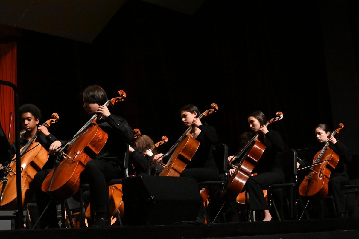 The 8th grade and high school cellists display their skill. 