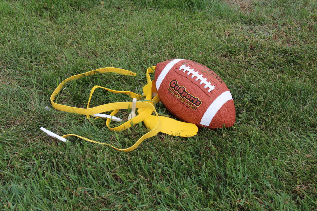 The standard athletic equipment for flag football, a flag to tag players and a football  for scoring.