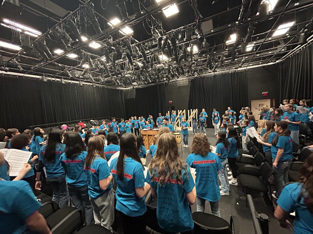 West choir and middle school students rehearse before their performance