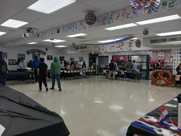 Students go table to table to see what each cultural club has to try. 