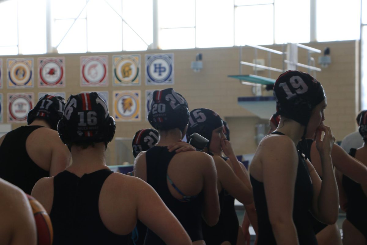 Girls+varsity+water+polo+calms+their+nerves+before+heading+into+the+game.