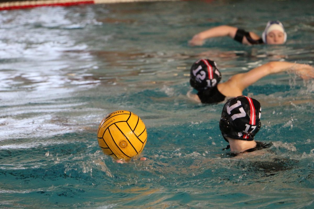 Girls water polo stay in motion with offense preparing to catch and defense preparing to block.