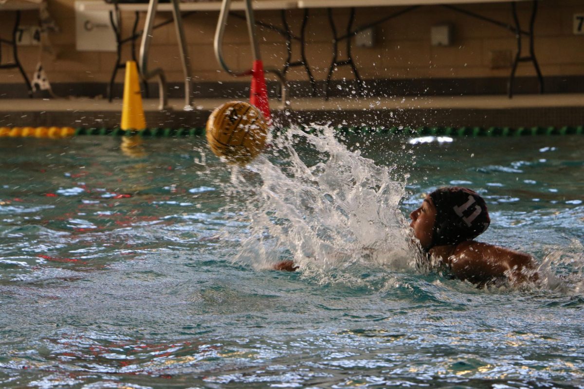 Senior Abby Lopez swims to the ball that has just been passed to her