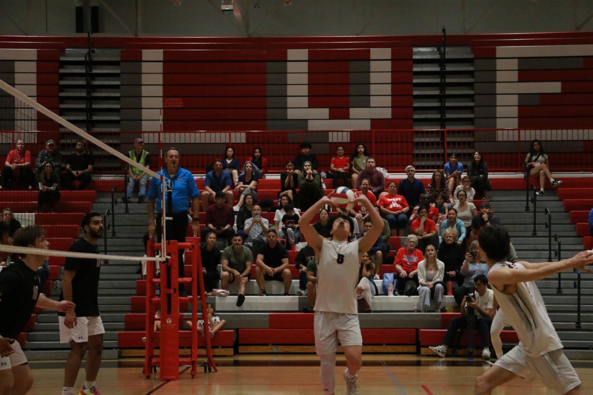 Kazuyoshi Watanabe, junior, sets up the middle in order to get a kill.