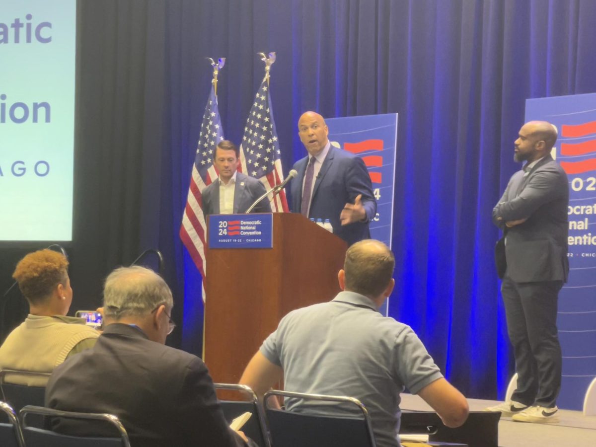 Senator Cory Booker of New Jersey addresses journalists at a press briefing at McCormick Place. Booker also addressed delegates at the Youth Caucus and on Wednesday night at the United Center.