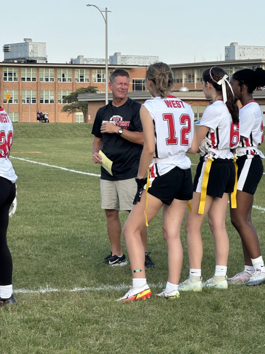 Scott Baum coaching some of his players before they go back on to the field. 