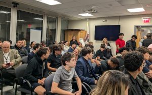 West football players attend the D219 board meeting on Oct. 8 in support of Coach Nick Torresso who is on leave.