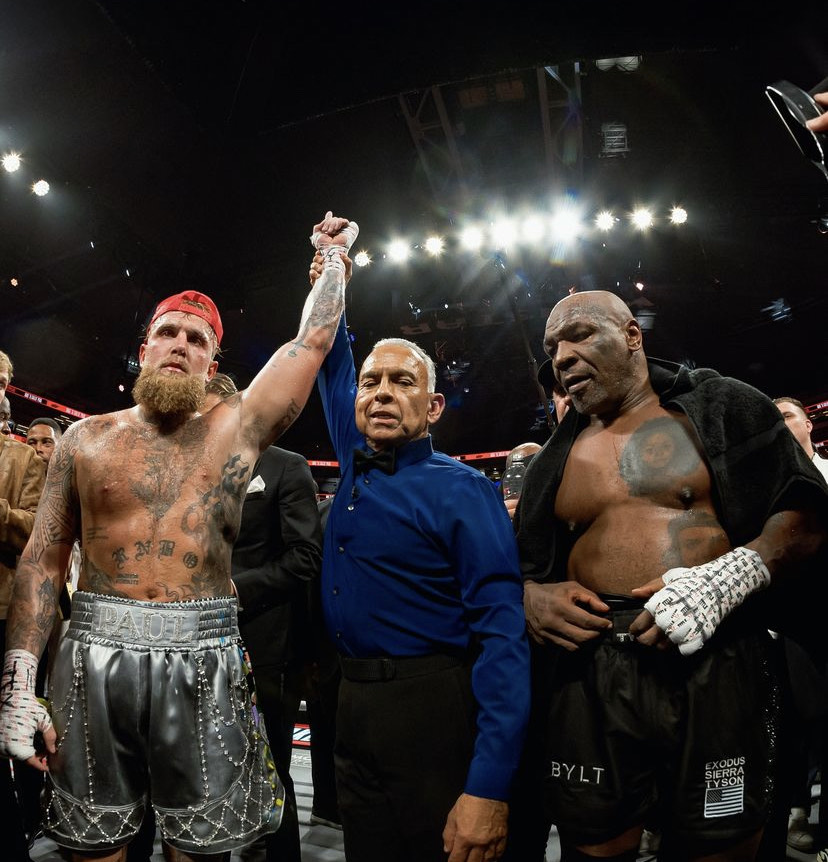 The referee (Middle) declares the winner by unanimous decision Jake Paul (left) over Mike Tyson (Right). 