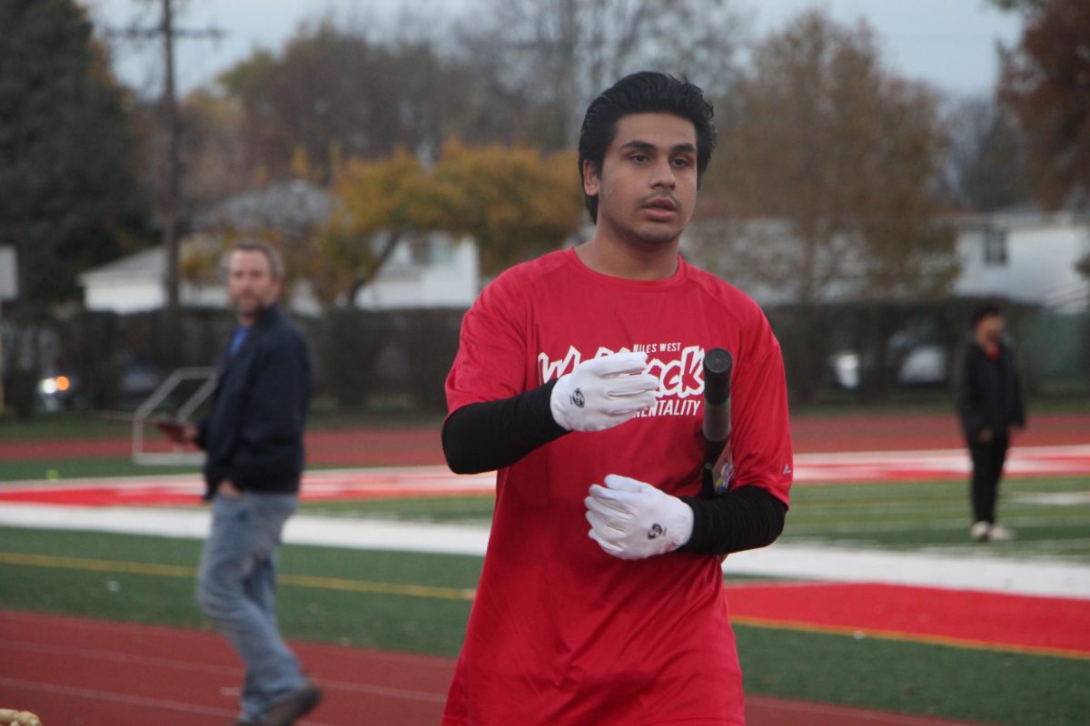 Zeeshan prepares to switch playing positions with his batting partner. 