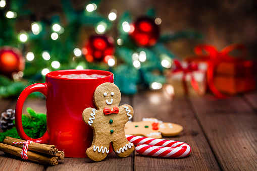 A table filed with December themed items that represent the Holidays. 