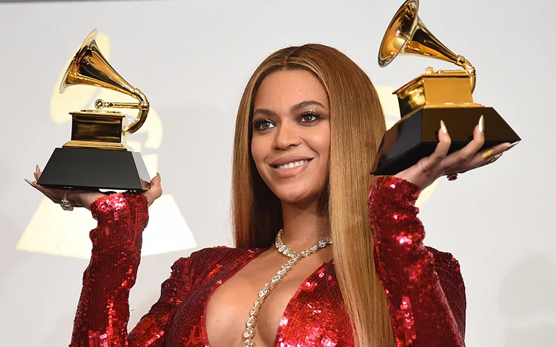 Singer Beyoncé holding two GRAMMY awards at the 63rd GRAMMY's.