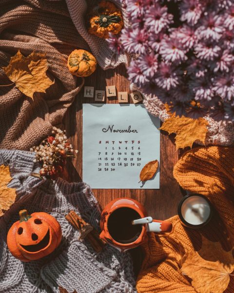 An arrangement of November themed items around a calendar.