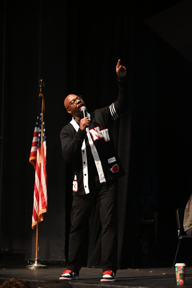 Principal Jeremy Christian begins the Winter Assembly with a speech about finishing the semester strong.