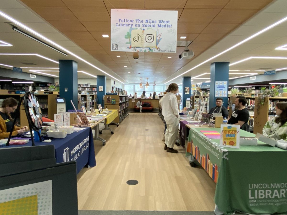 The entrance of the Niles West library is set-up for Library-Con with stations displaying student artwork. Several tables were dedicated for attendees to learn more about local libraries. 