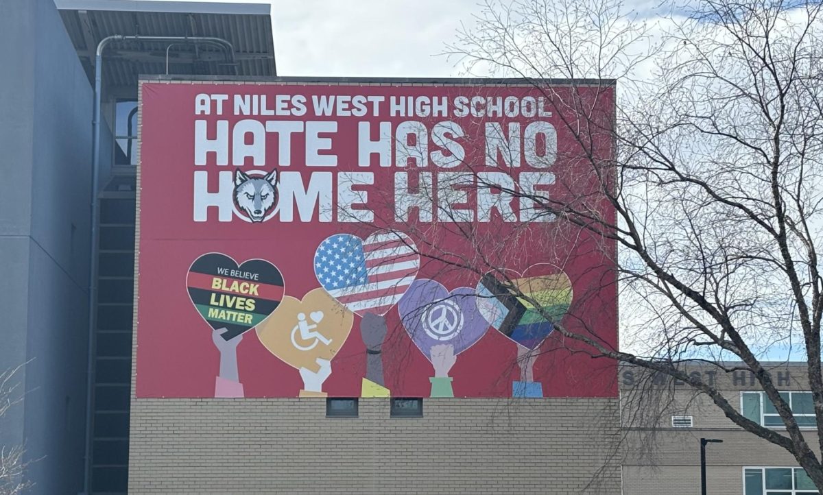 The "hate has no home here" banner hangs on the east side of the building. 