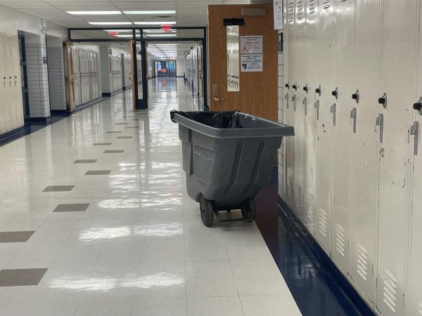 Go Green club uses a grey rolling cart called a gondola to pick up papers every Tuesday for recycling.