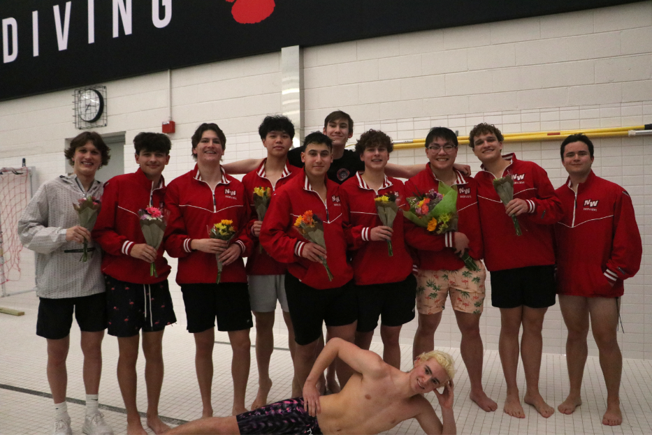 The Niles West class of 2025 swim team poses for a picture. The 12 seniors were recognized for their commitment to the team and the hard work they left on the swim deck for the past four years.  