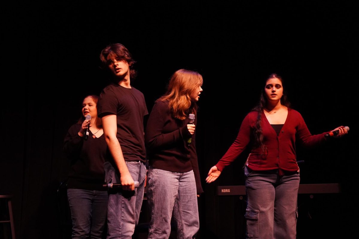 Juniors Jamie Hoffman, Henry RIley, Emma Shimon and senior Abbey DuBois argue over who is to serve as the master of ceremonies for the show. 